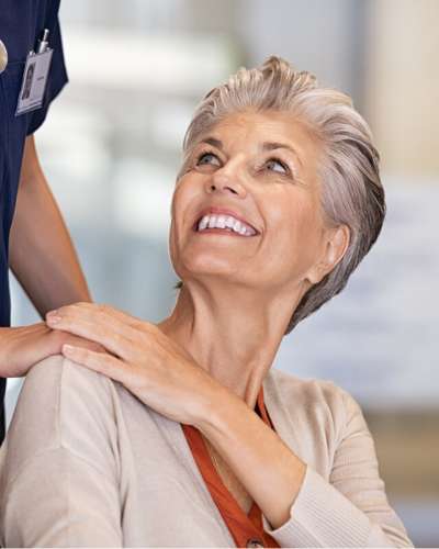 caring-nurse-comforting-old-woman-2022-03-07-17-47-45-utc.jpg